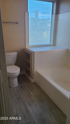 a view of a lake with a house in the background