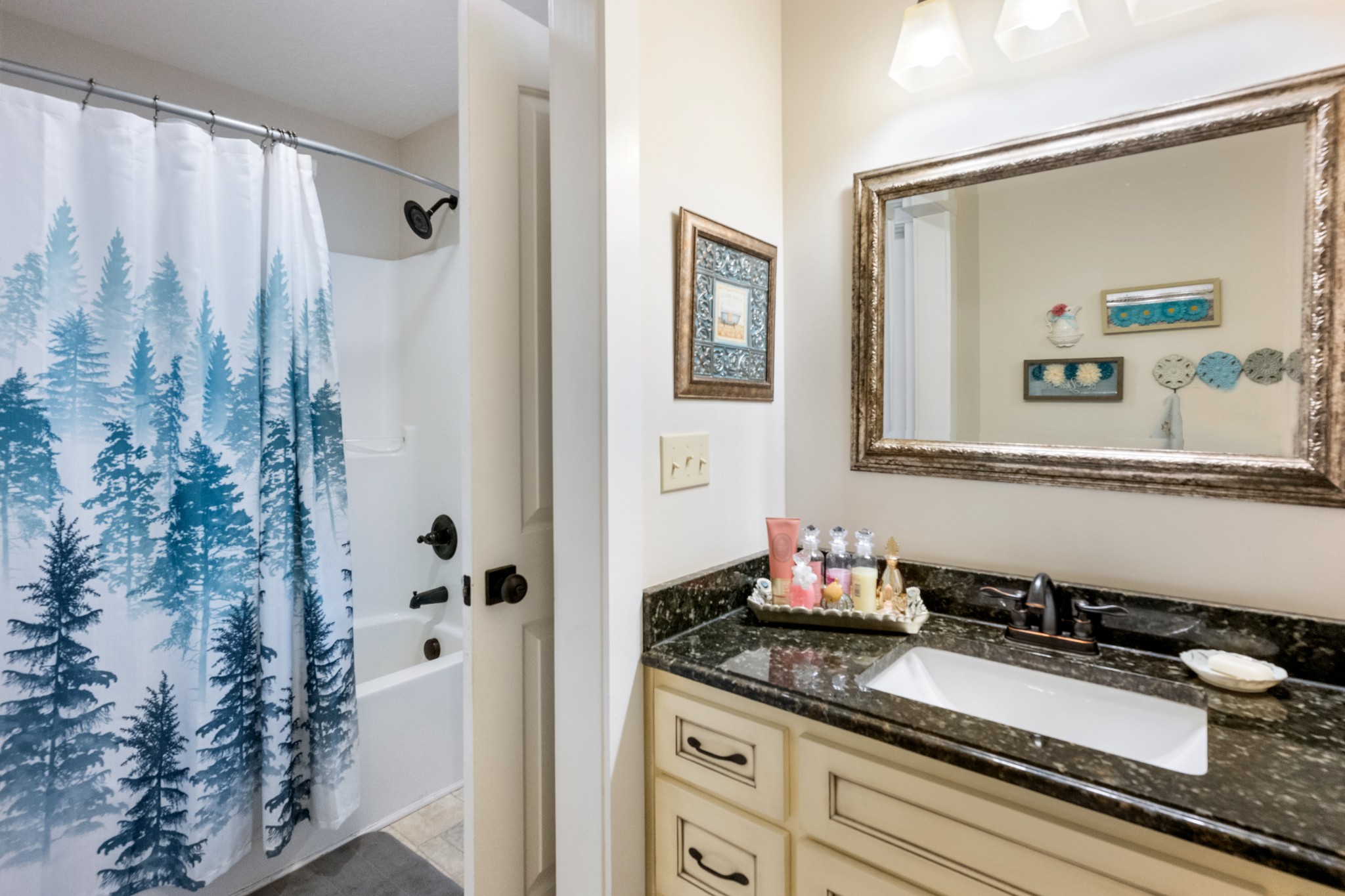 828 Kirbytown Road Lafayette, TN 37083 - Photo 13 of 30 a bathroom with a granite countertop sink and a mirror