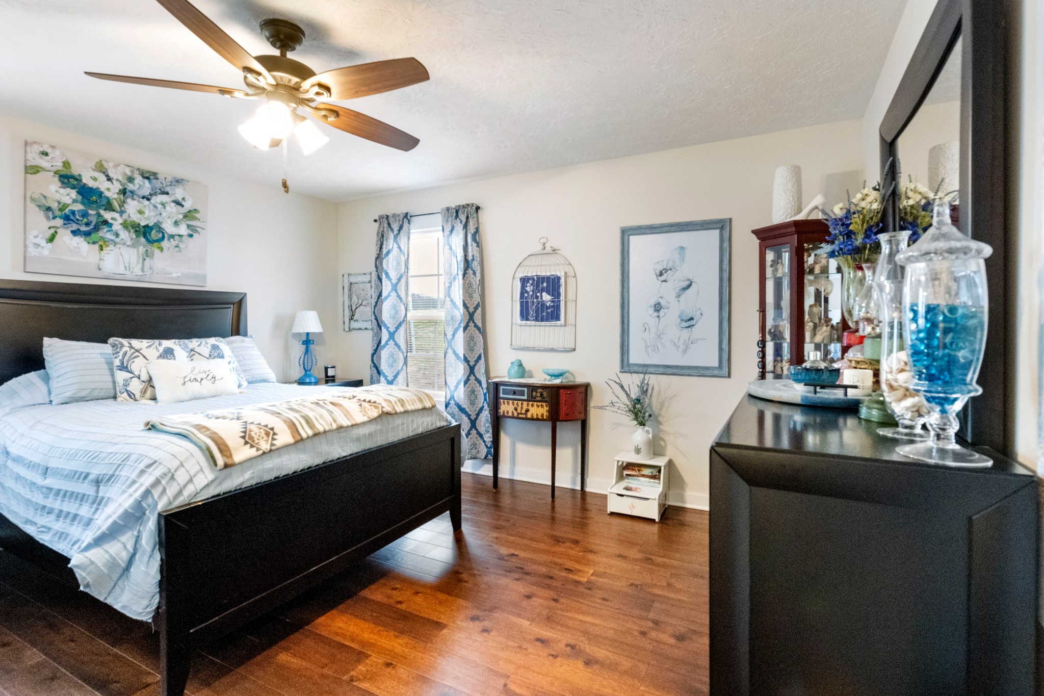 828 Kirbytown Road Lafayette, TN 37083 - Photo 14 of 30 a bed room with a bed and a chandelier