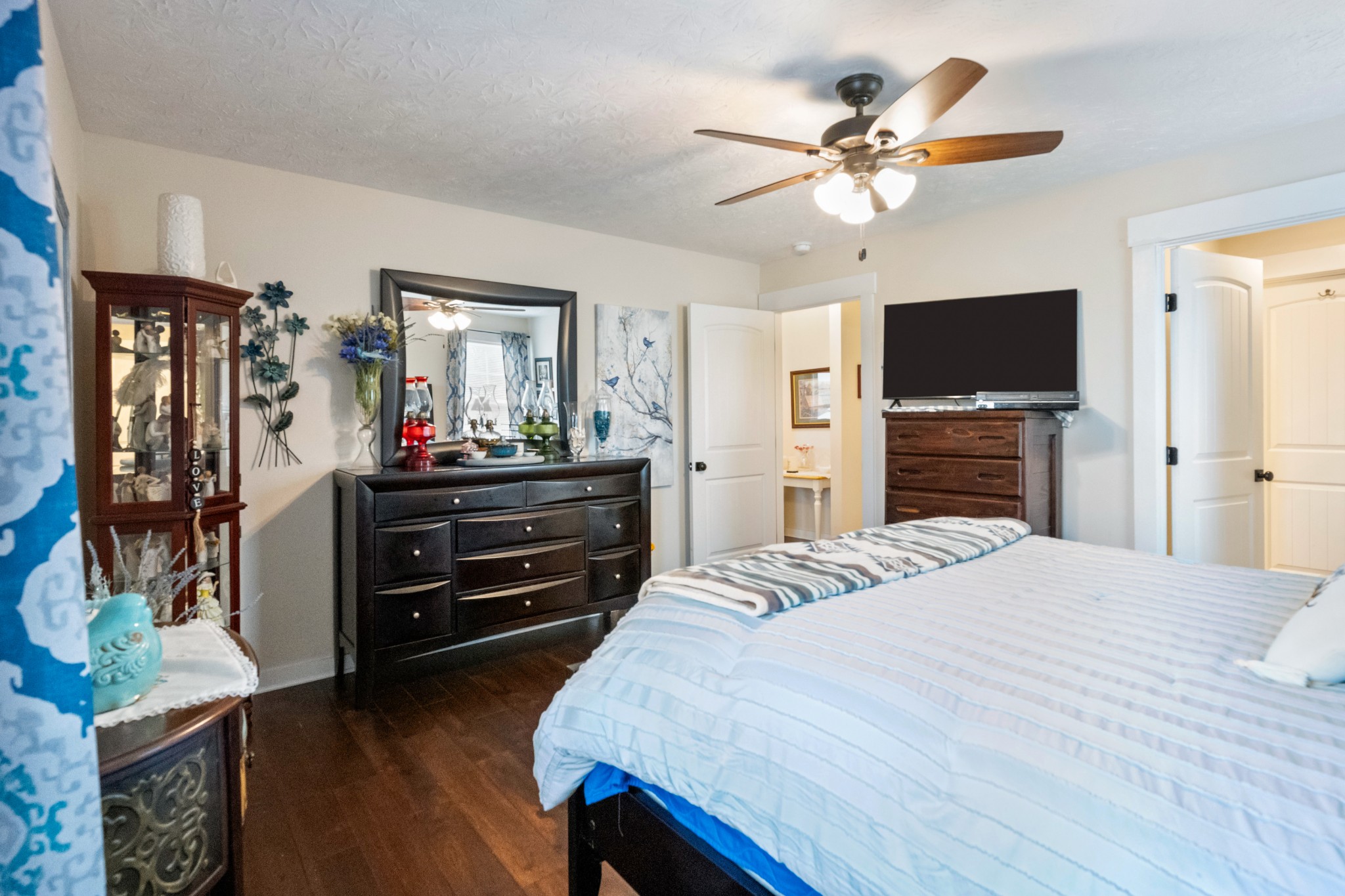 828 Kirbytown Road Lafayette, TN 37083 - Photo 16 of 30 a bedroom with a bed and a flat screen tv