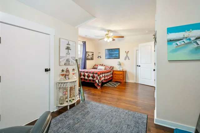 a living room with furniture a window and a lamp