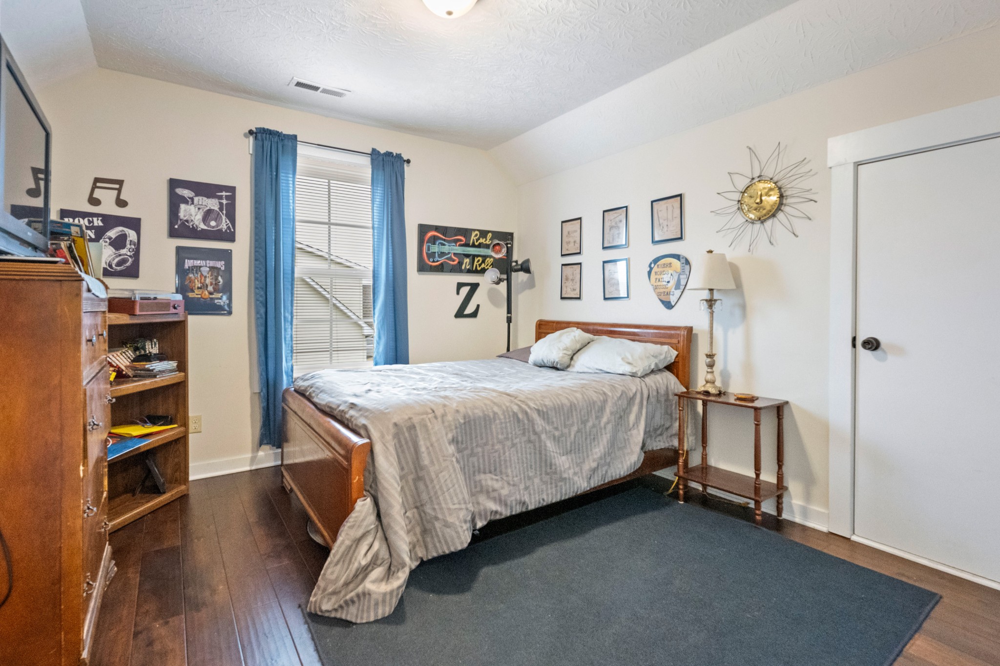 828 Kirbytown Road Lafayette, TN 37083 - Photo 23 of 30 a bedroom with a bed and a book shelf