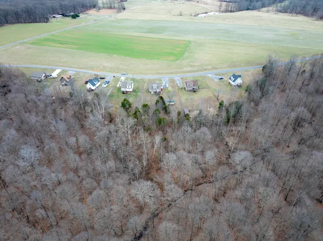 a view of a field with an ocean space