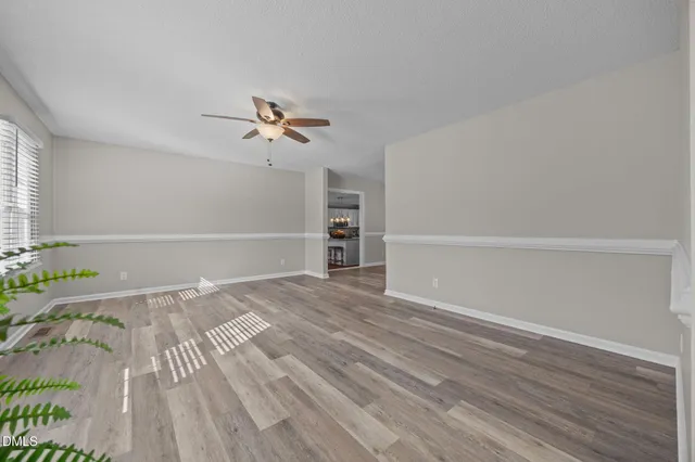 a view of an entryway with wooden floor
