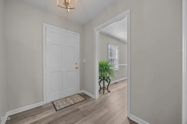 a view of an empty room with windows