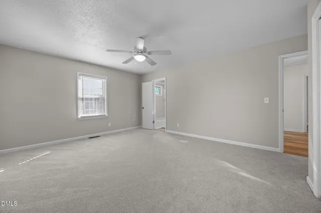 a bathroom with a sink toilet and a mirror