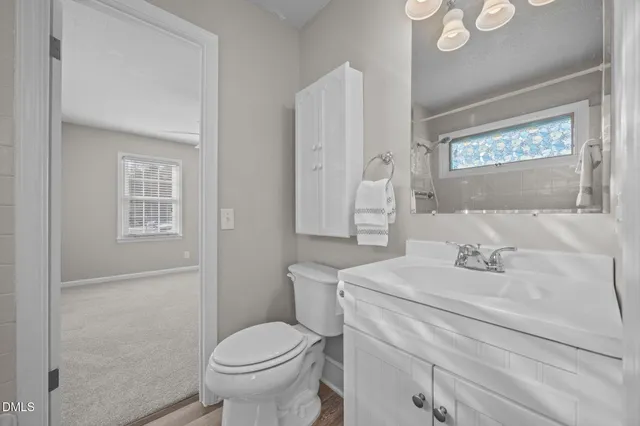 a view of an empty room with a ceiling fan