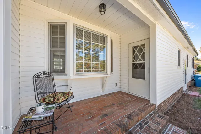 a view of house with outdoor space and lake view