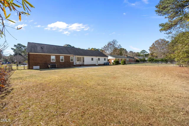 a balcony with table and chairs
