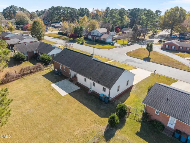 an aerial view of a house with a swimming pool