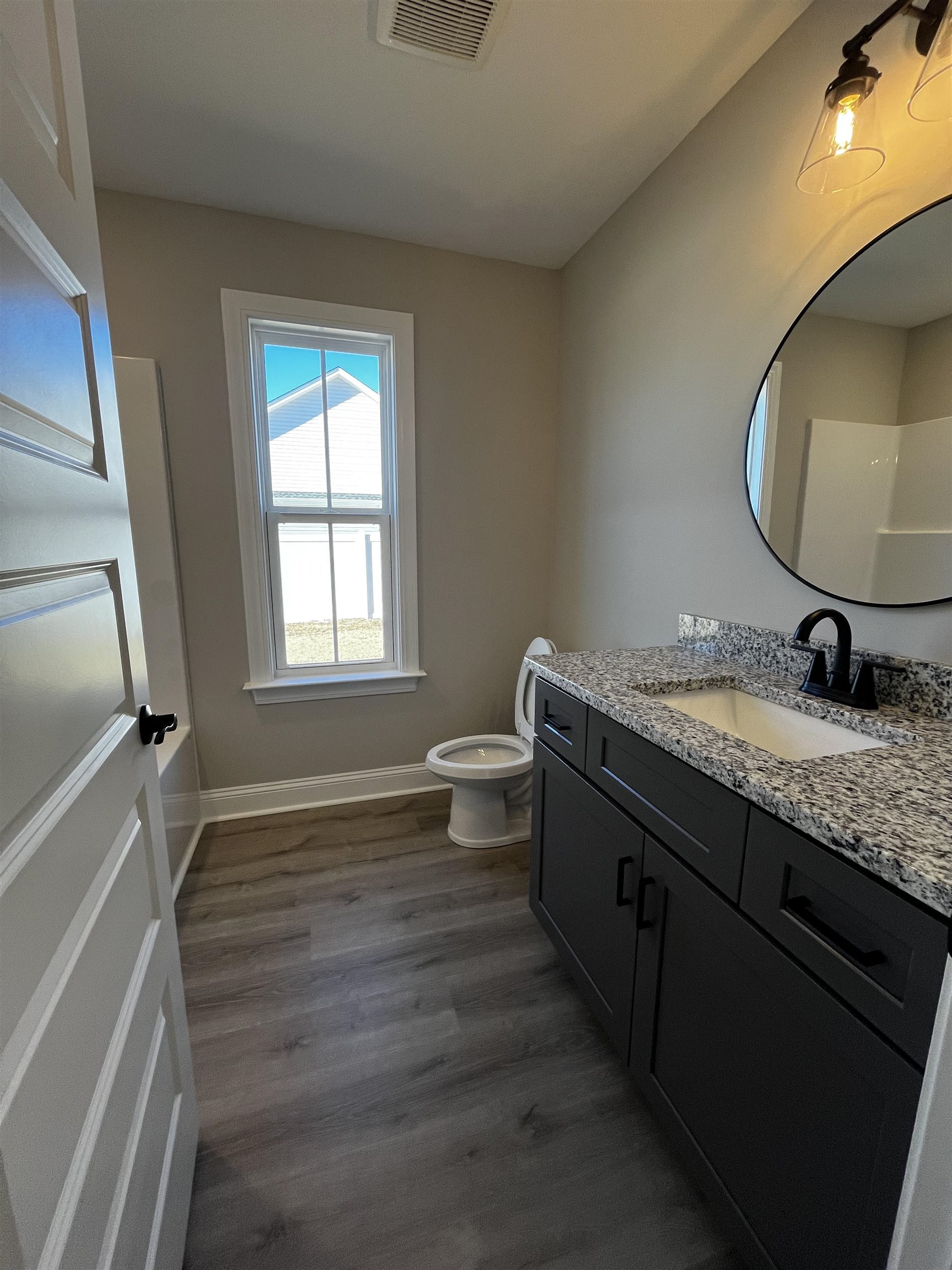 3436 Asbury Road Aynor, SC 29511 - Photo 8 of 9 Bathroom with vanity and dark wood-type flooring