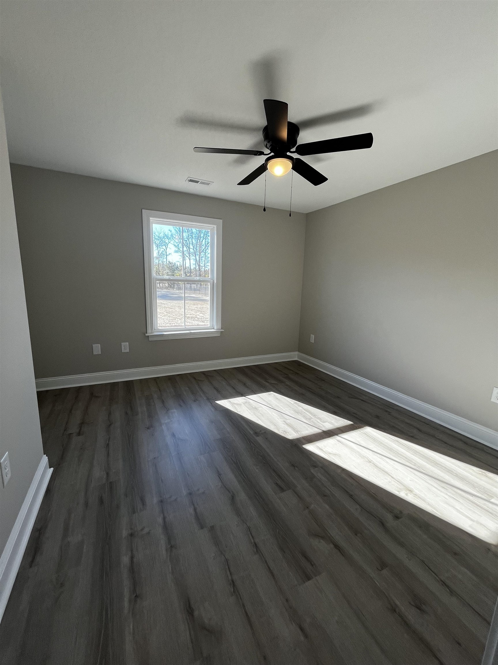 3436 Asbury Road Aynor, SC 29511 - Photo 9 of 9 Spare room with dark wood finished floors and ceiling fan