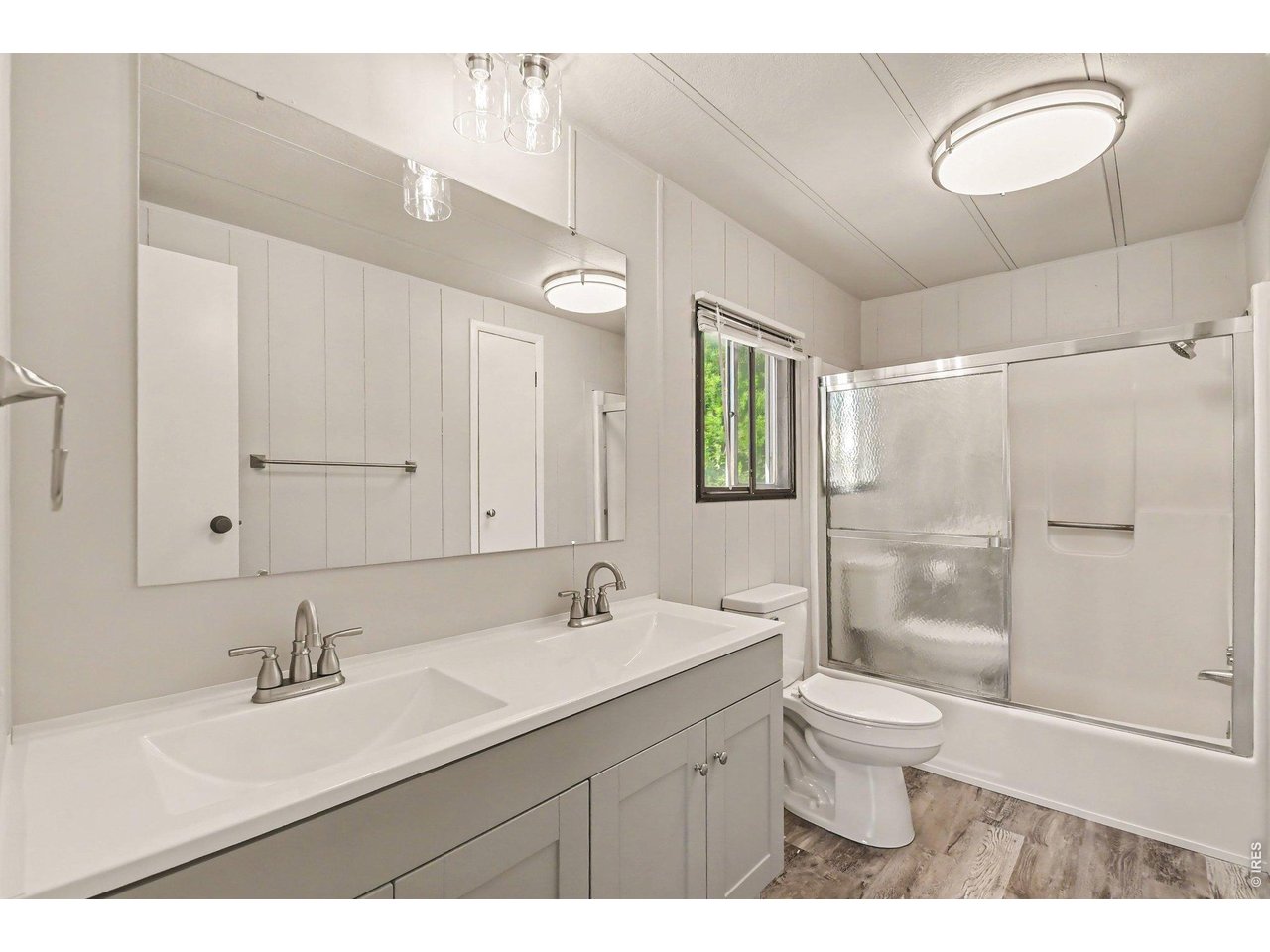8317 6th Street Wellington, CO 80549 - Photo 12 of 21 Private primary bath with updated double vanity