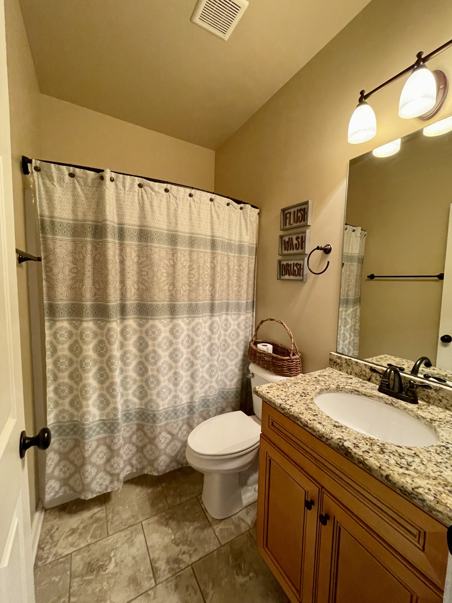 103 Philadelphia Road Lebanon, TN 37087 - Photo 13 of 22 a bathroom with a granite countertop sink toilet and shower
