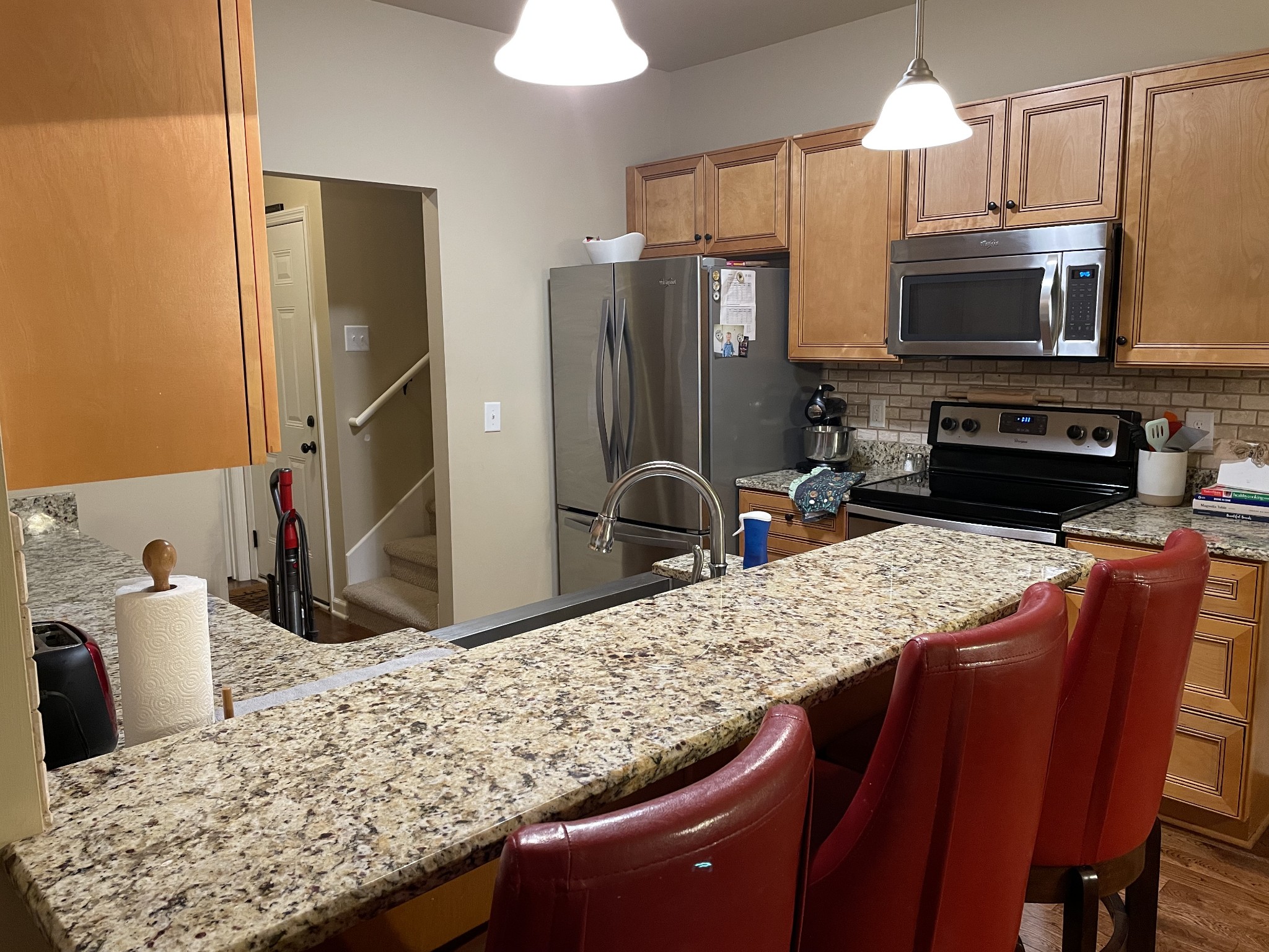 103 Philadelphia Road Lebanon, TN 37087 - Photo 17 of 22 a kitchen with stainless steel appliances kitchen island granite countertop a sink refrigerator and microwave
