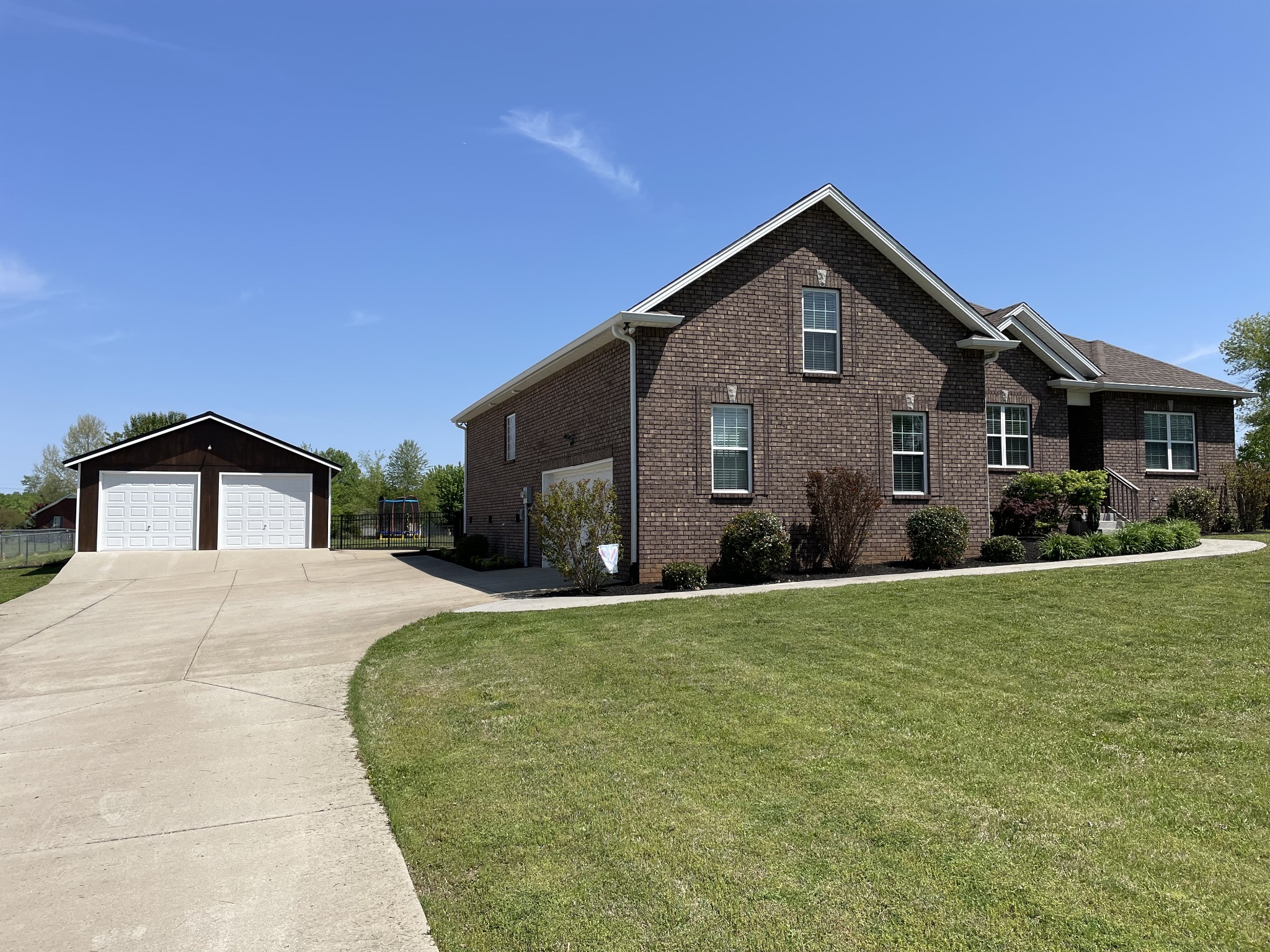 103 Philadelphia Road Lebanon, TN 37087 - Photo 2 of 22 a front view of a house with a yard and garage