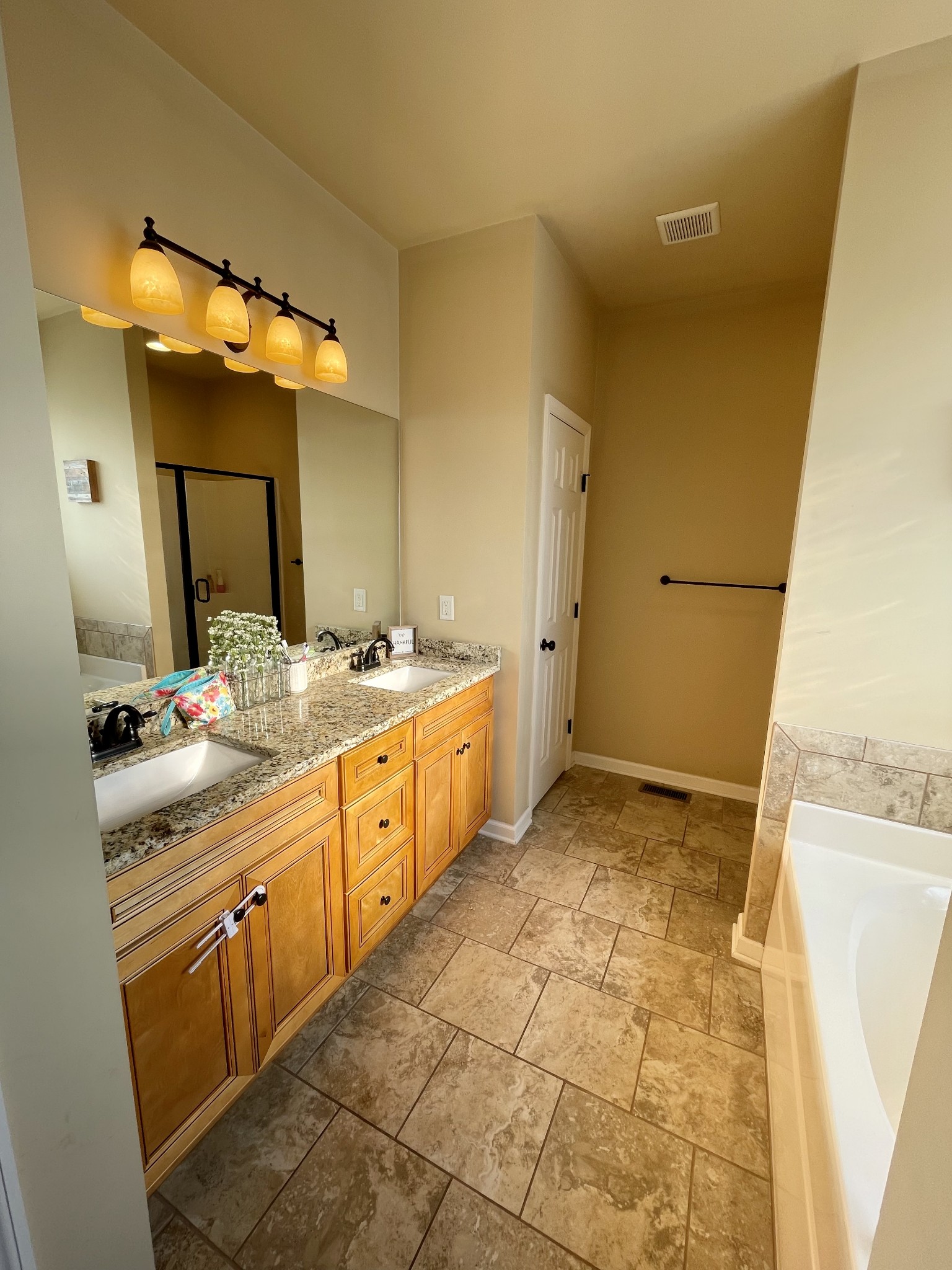 103 Philadelphia Road Lebanon, TN 37087 - Photo 8 of 22 a bathroom with a double vanity sink mirror and