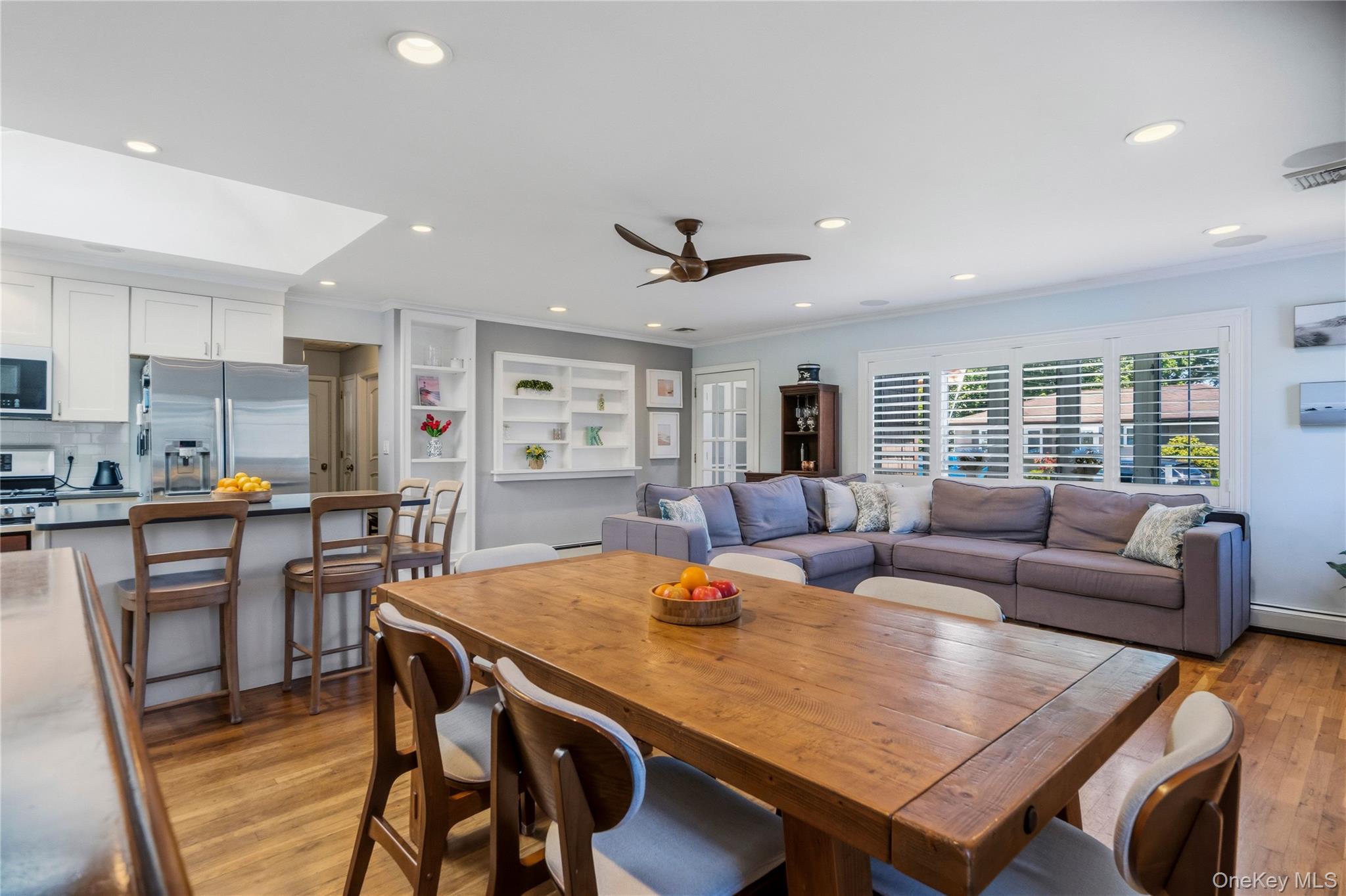 190 Sexton Road West Babylon, NY 11704 - Photo 12 of 28 a living room with furniture kitchen view and a wooden floor