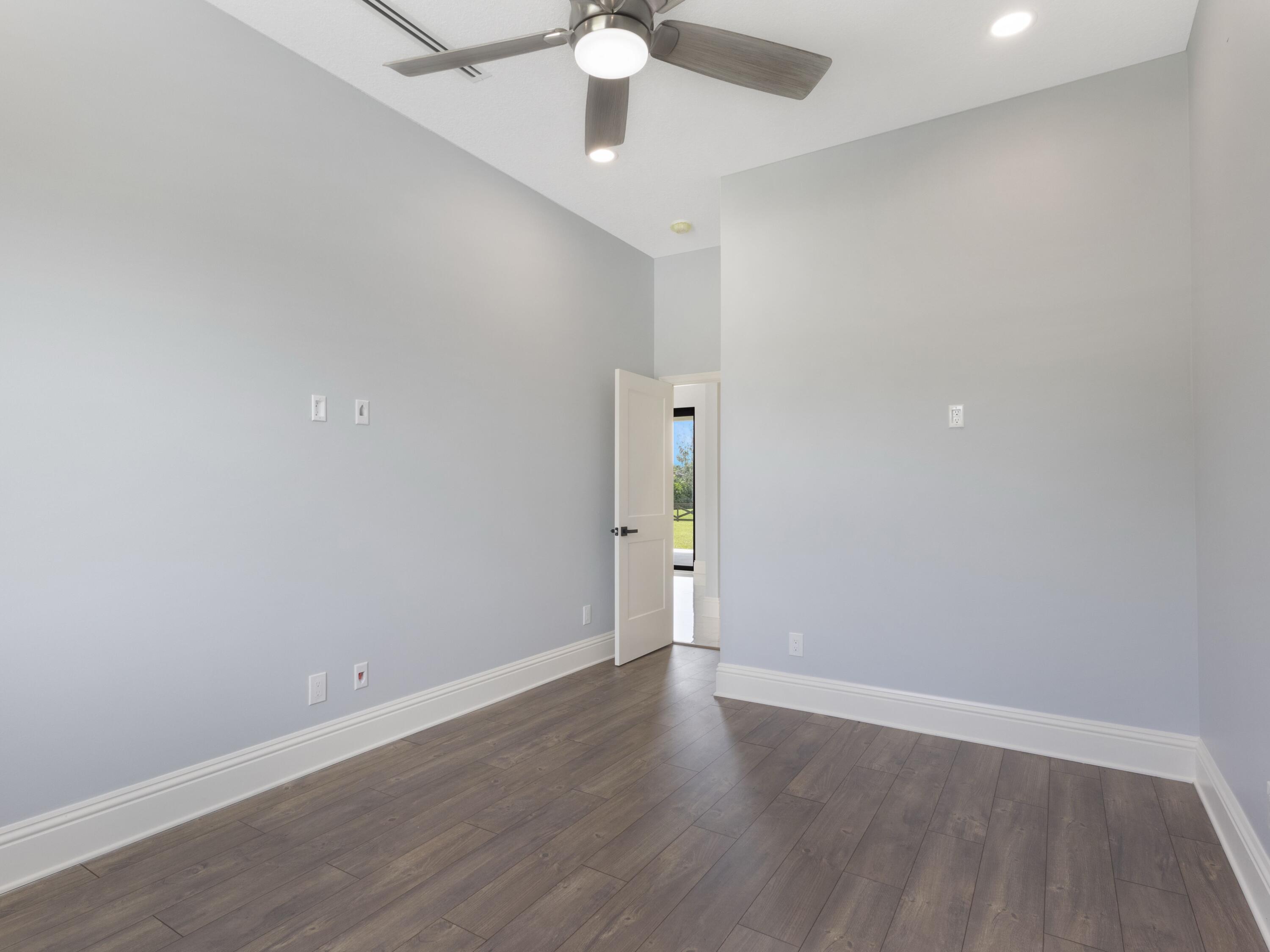 17436 71st Lane North Loxahatchee, FL 33470 - Photo 36 of 50 a view of an empty room with wooden floor