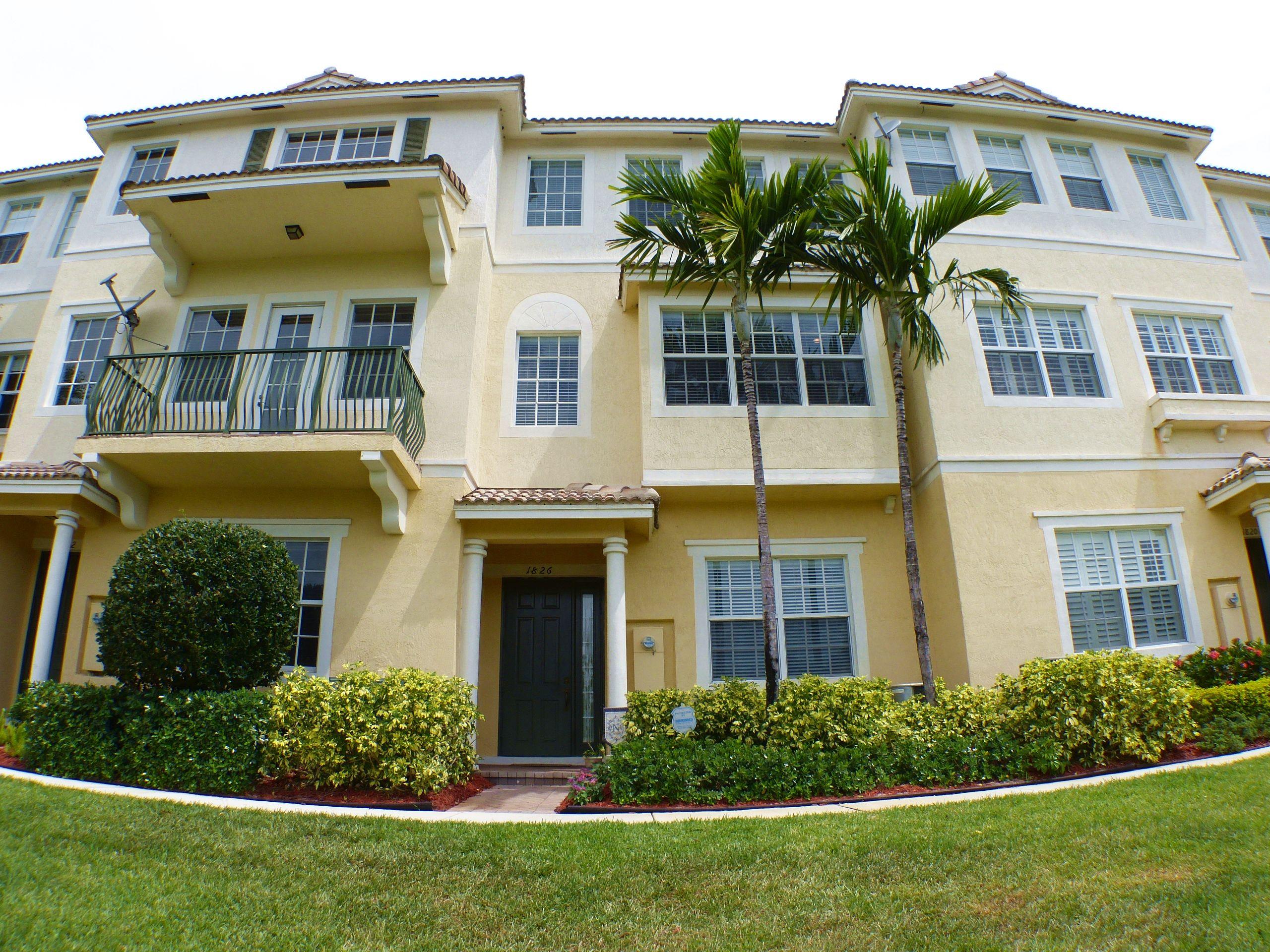 1826 Northwest 9th Street Boca Raton, FL 33431 - Photo 1 of 22 a front view of a house with garden