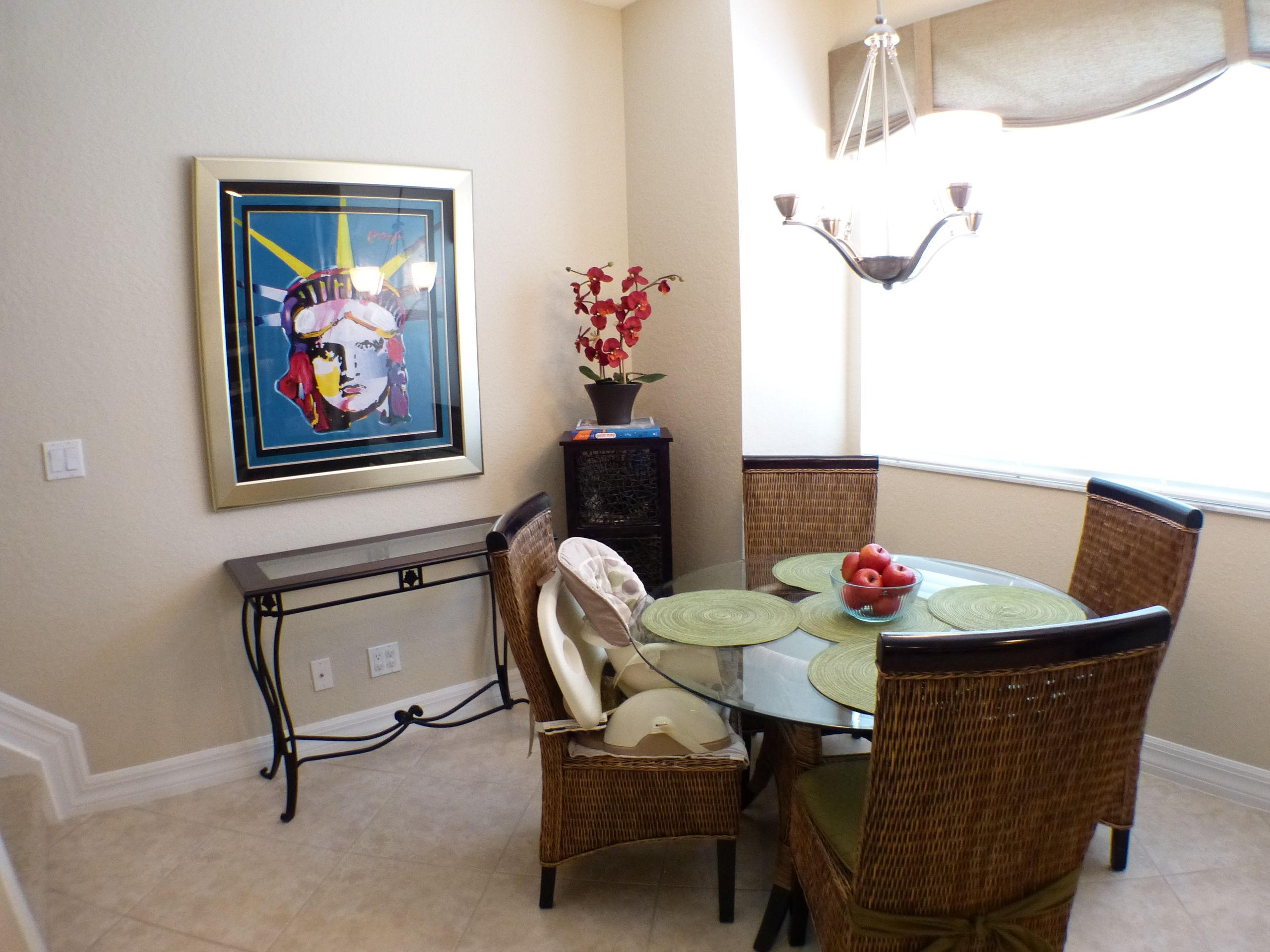 1826 Northwest 9th Street Boca Raton, FL 33431 - Photo 11 of 22 a view of a dining room with furniture and wooden floor
