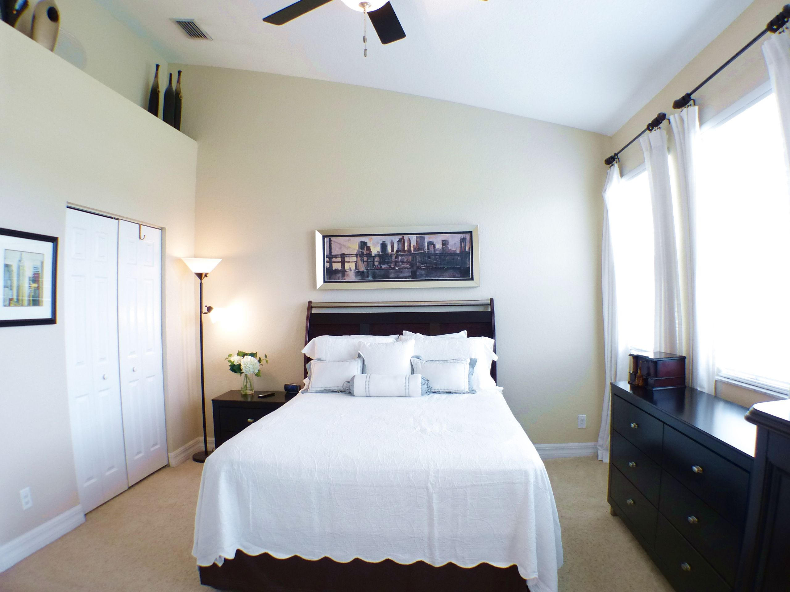 1826 Northwest 9th Street Boca Raton, FL 33431 - Photo 14 of 22 a bedroom with a bed and a flat tv screen on the dresser