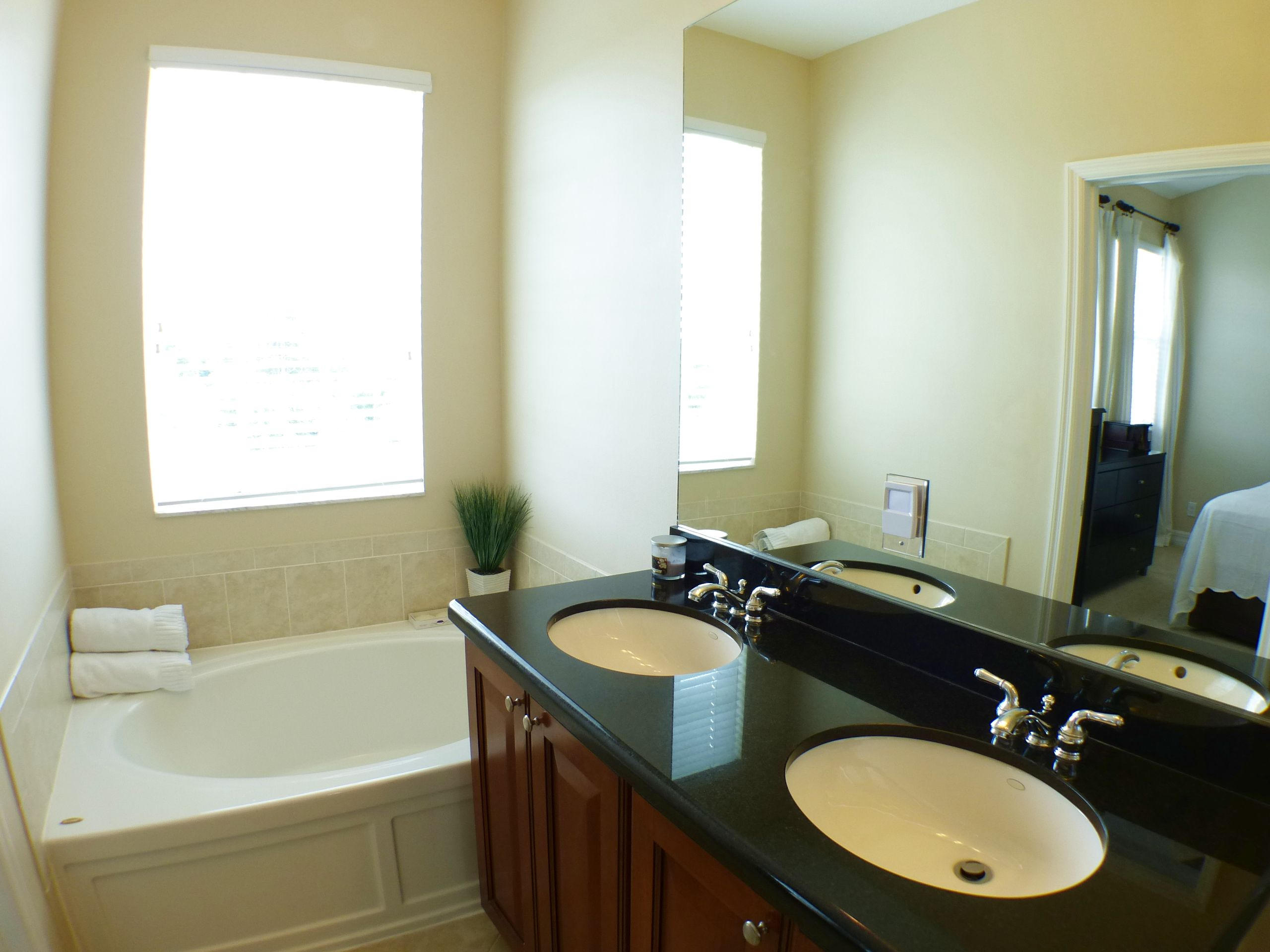1826 Northwest 9th Street Boca Raton, FL 33431 - Photo 16 of 22 a bathroom with a granite countertop sink and a mirror