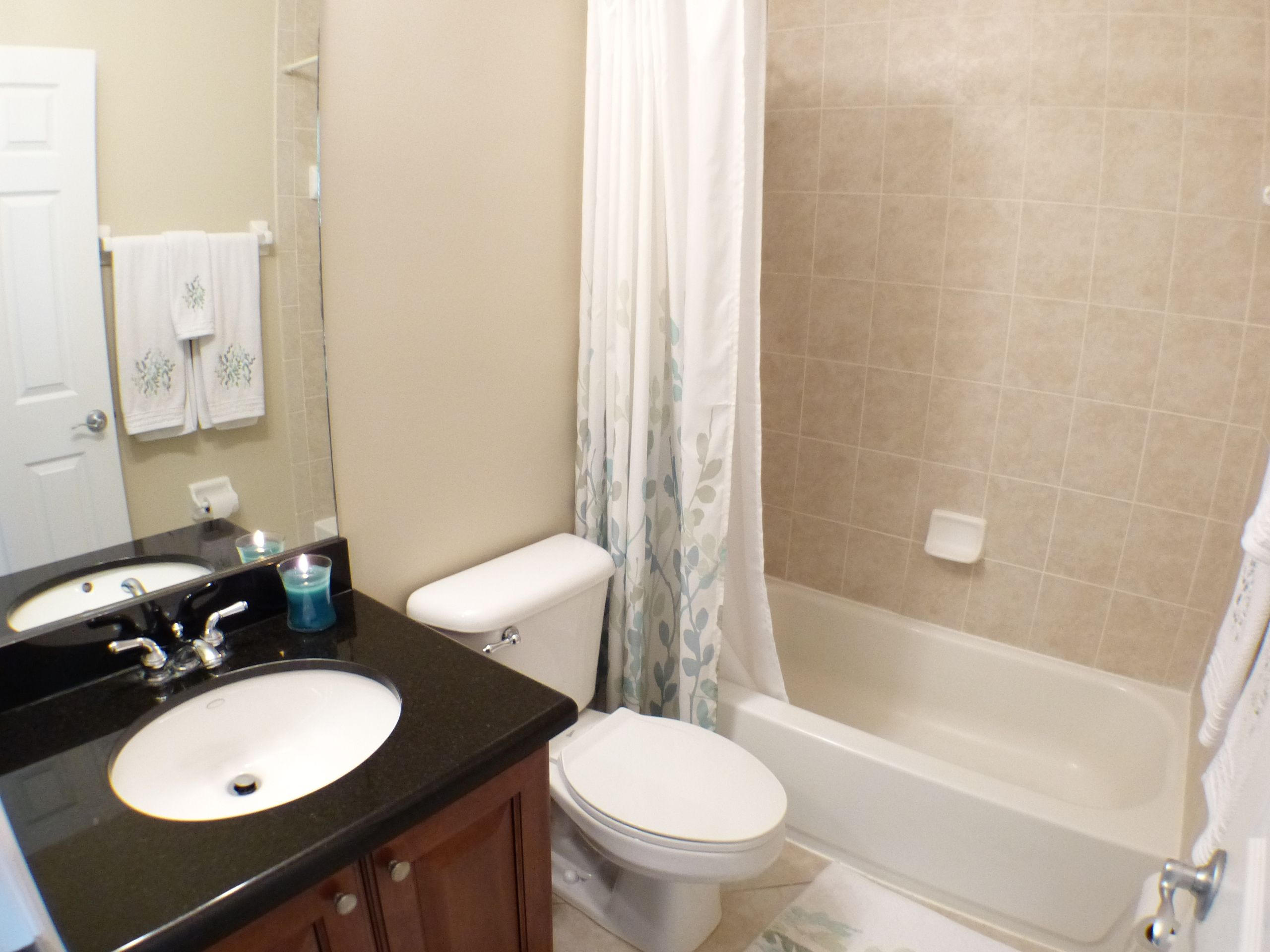 1826 Northwest 9th Street Boca Raton, FL 33431 - Photo 20 of 22 a bathroom with a toilet a sink and bathtub