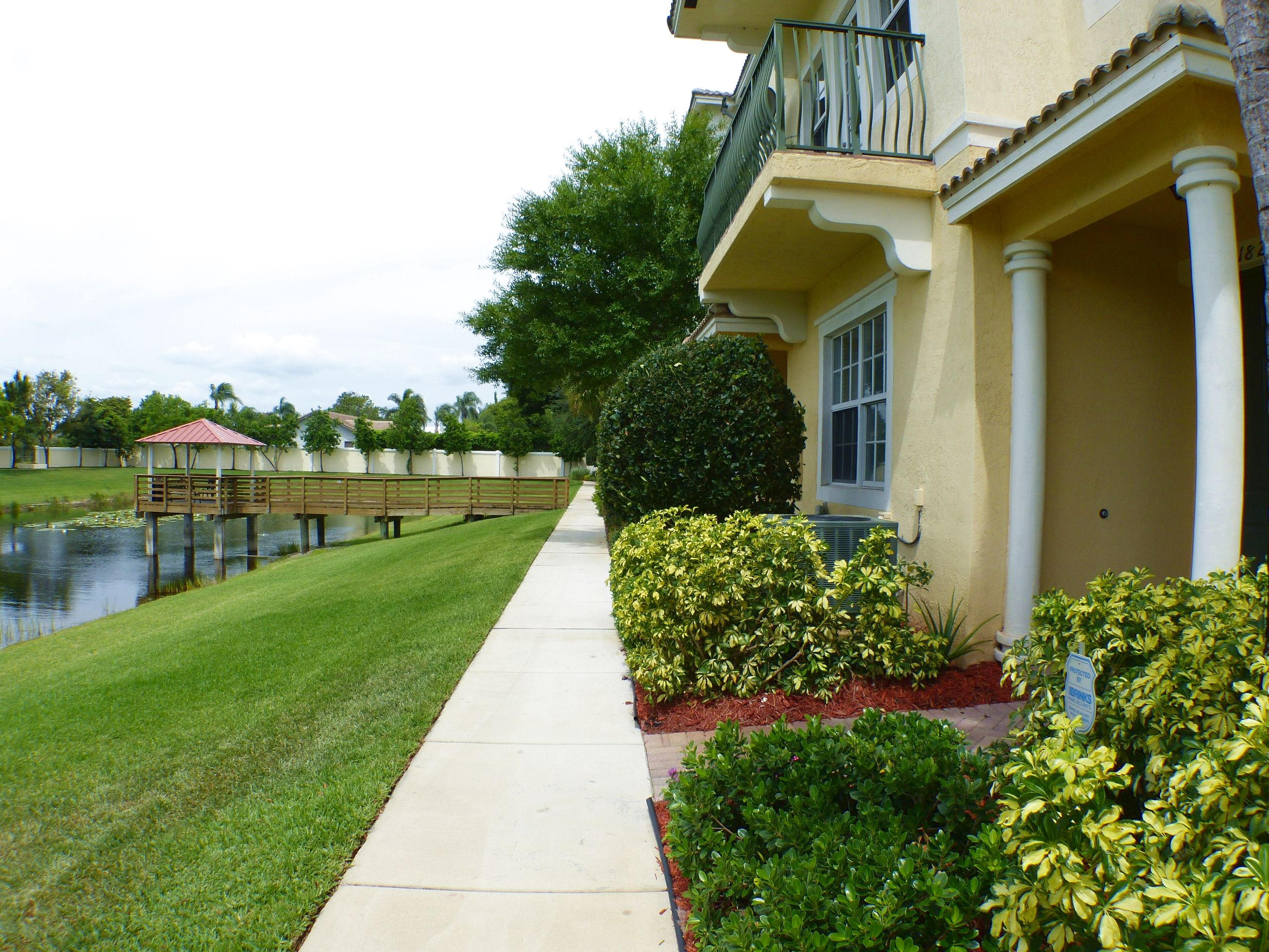 1826 Northwest 9th Street Boca Raton, FL 33431 - Photo 2 of 22 a view of a house with a garden and pathway