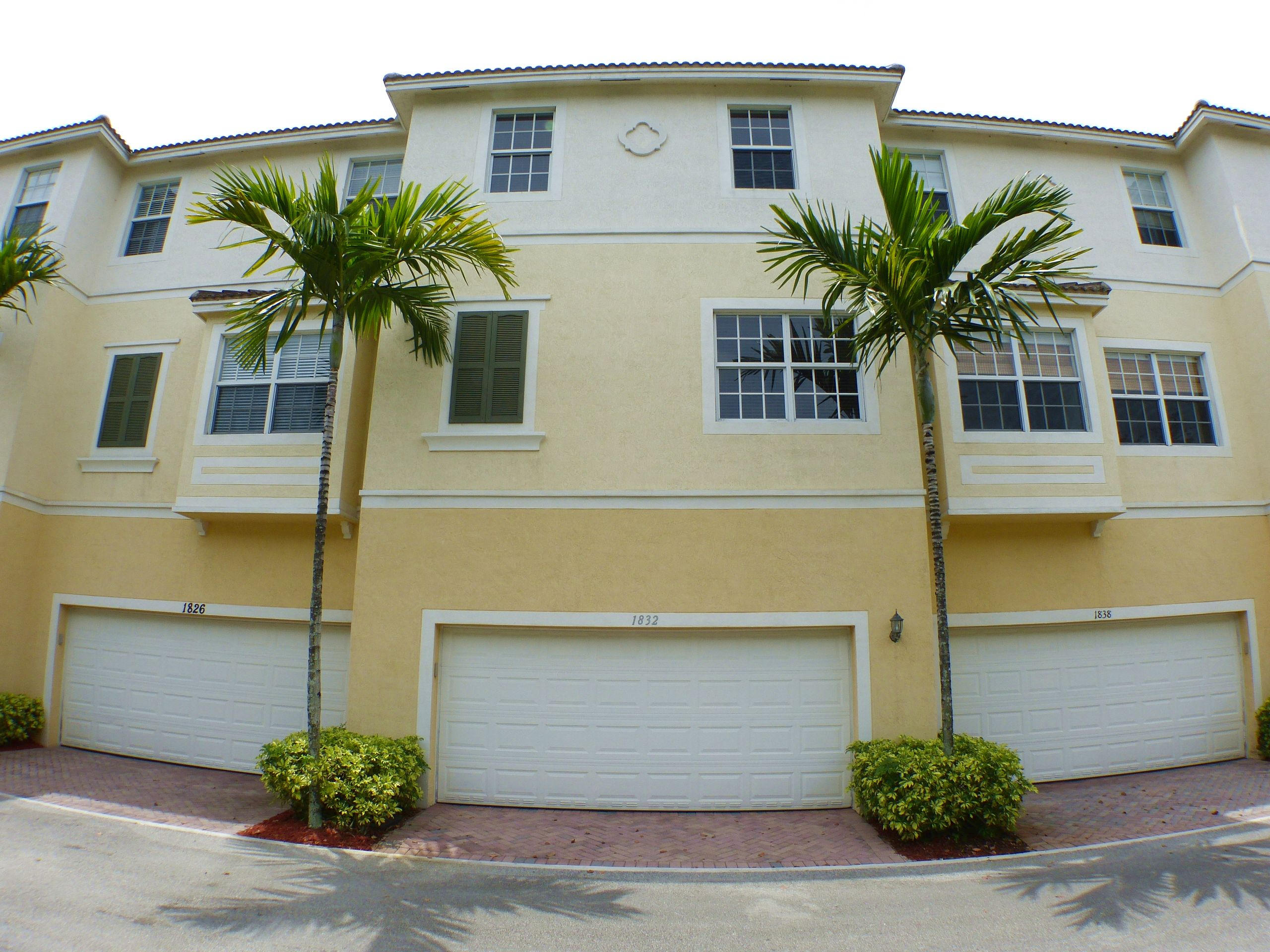 1826 Northwest 9th Street Boca Raton, FL 33431 - Photo 21 of 22 a front view of a house with a yard and garage