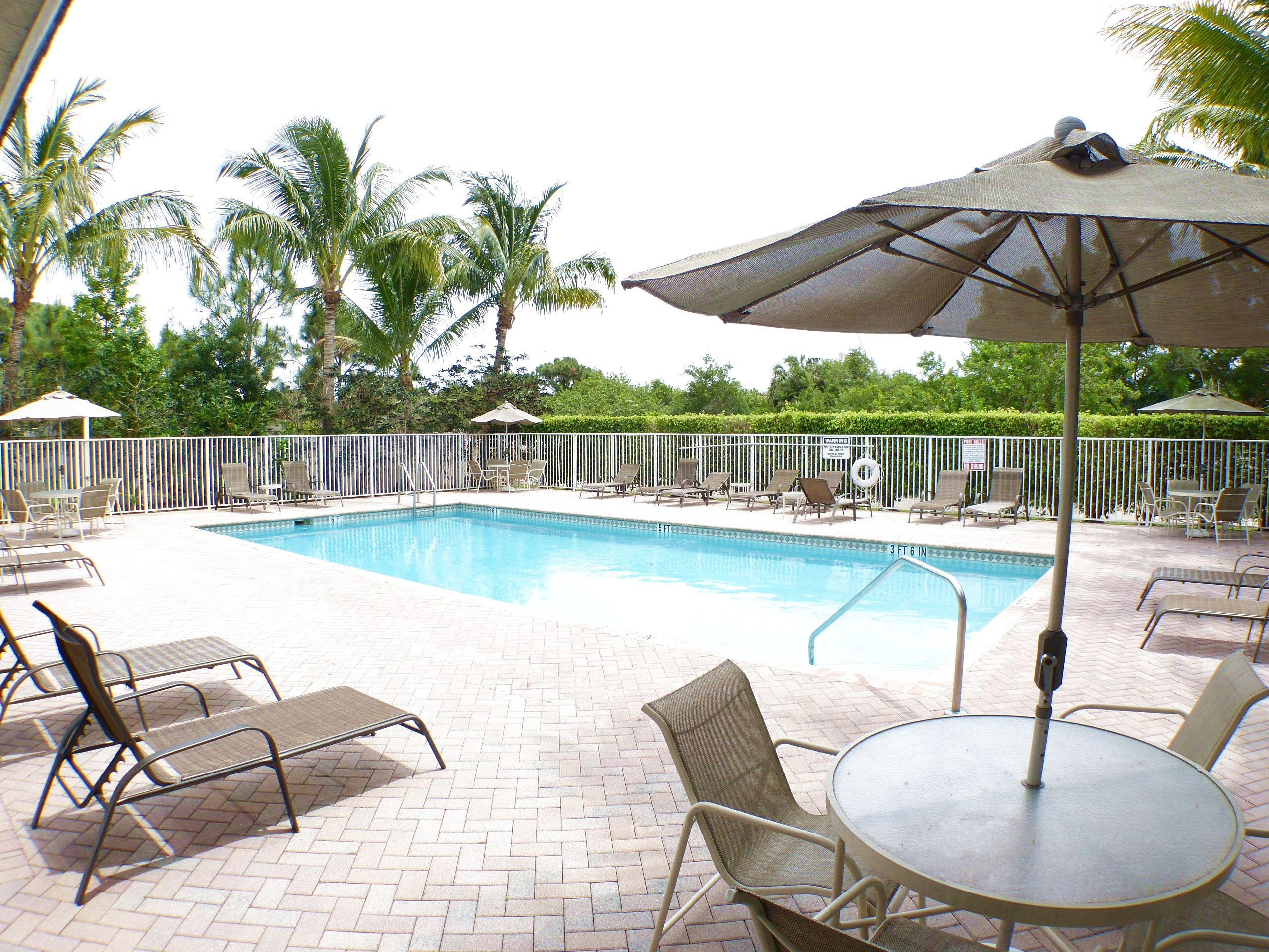 1826 Northwest 9th Street Boca Raton, FL 33431 - Photo 22 of 22 a view of a swimming pool with a lounge chairs