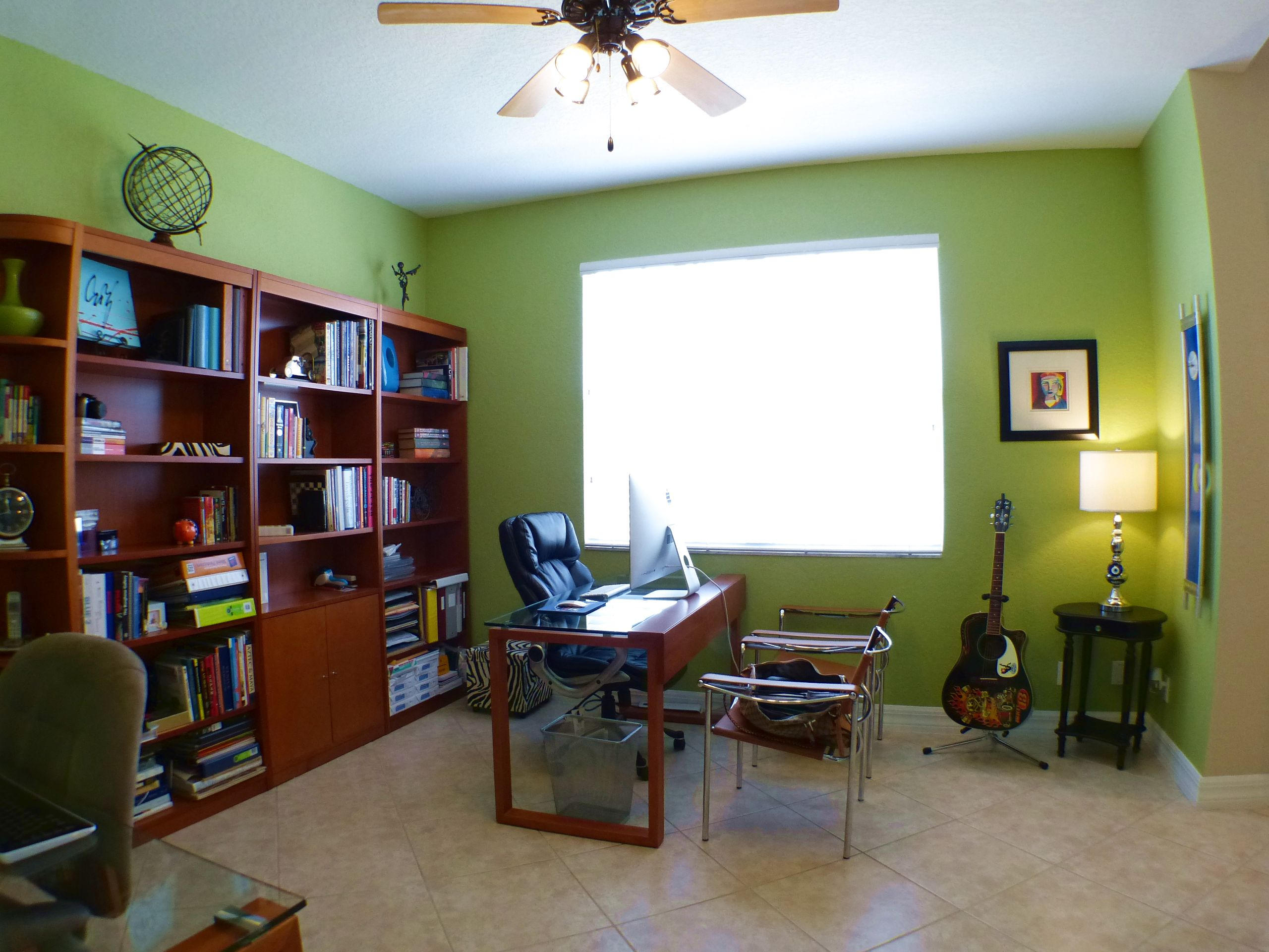 1826 Northwest 9th Street Boca Raton, FL 33431 - Photo 4 of 22 a living room with furniture and a book shelf