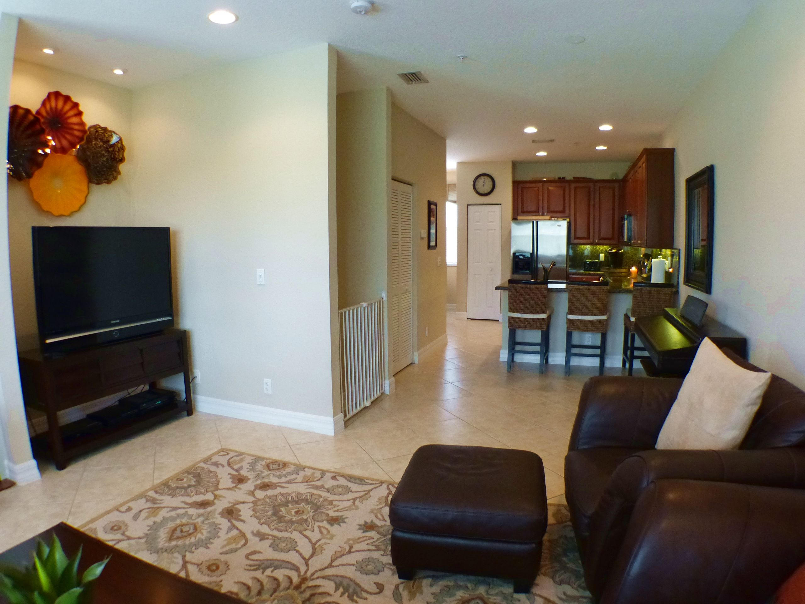 1826 Northwest 9th Street Boca Raton, FL 33431 - Photo 7 of 22 a living room with furniture and a flat screen tv