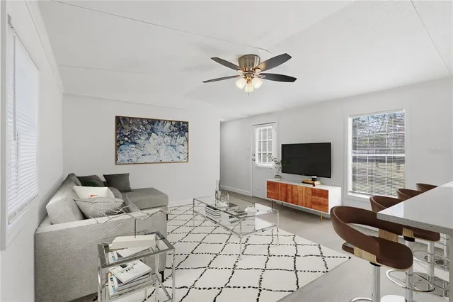 a living room with furniture and a window