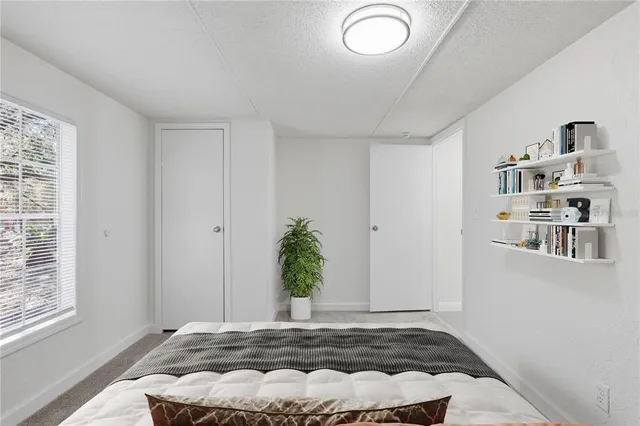 a bathroom with a sink toilet vanity and shower