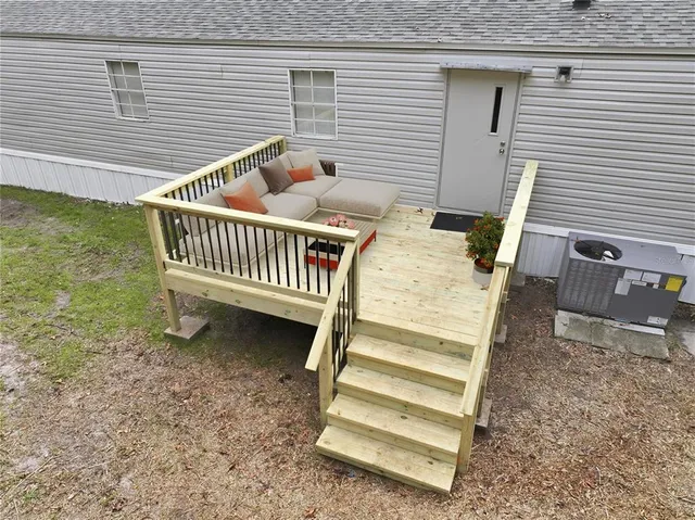 a view of a deck with a table and chairs
