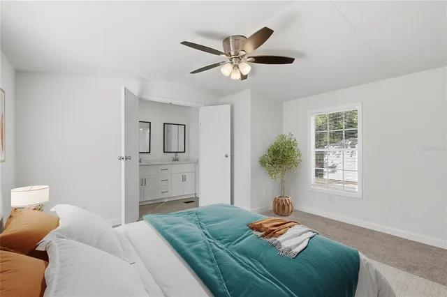 a bedroom with a bed and furniture