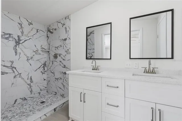 a bathroom with a sink and a mirror