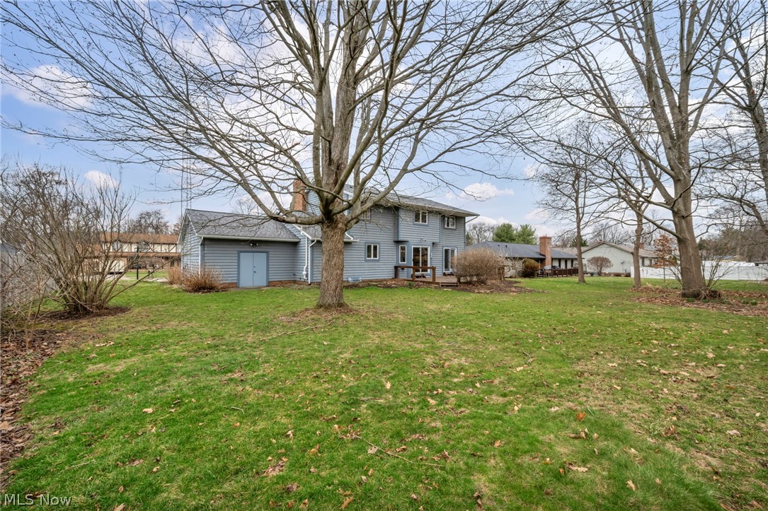 5162 Johnnycake Ridge Northeast Canton, OH 44705 - Photo 43 of 50 Back of property with a lawn and a chimney