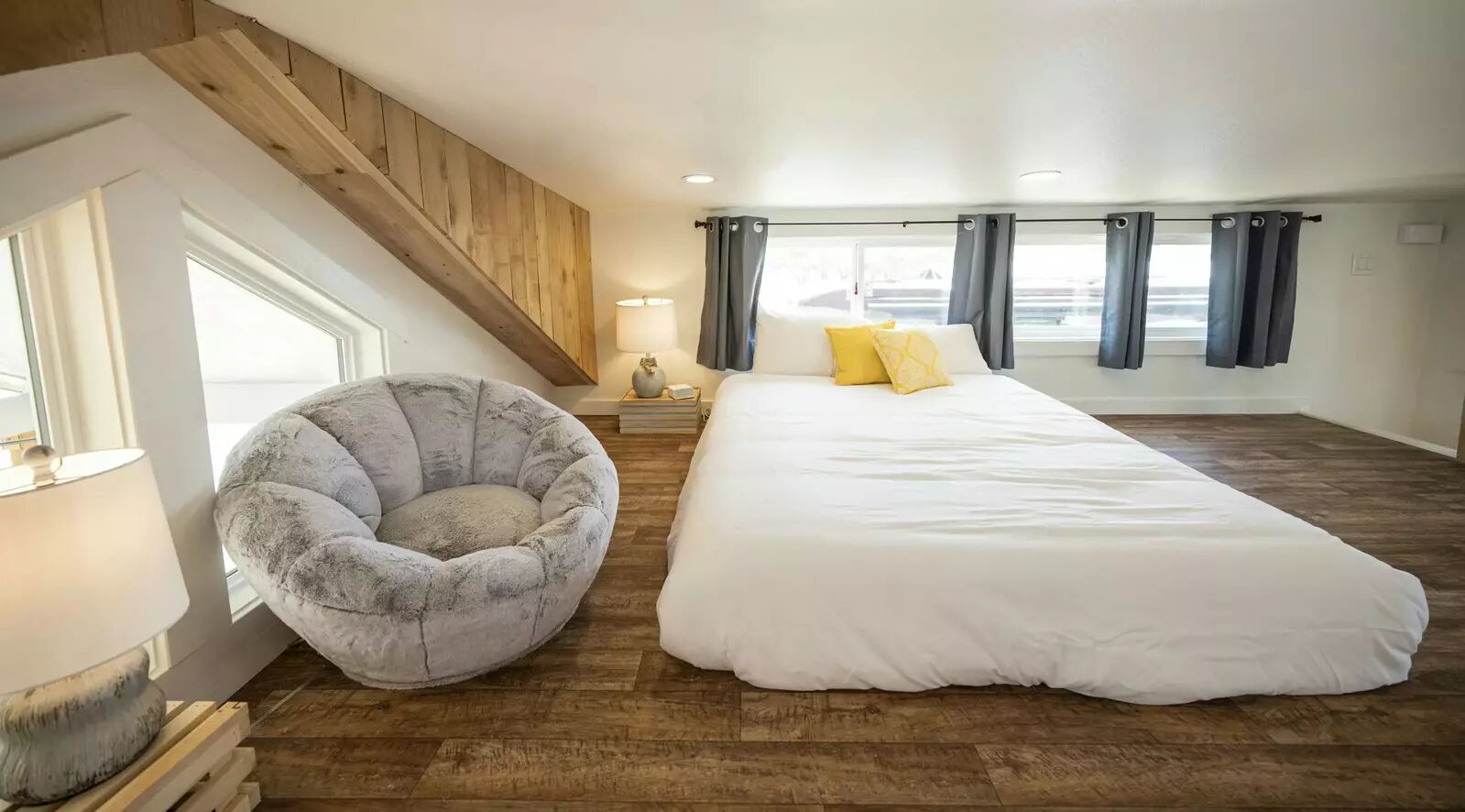 5386 Ranch Road 1376, Unit 79 Fredericksburg, TX 78624 - Photo 16 of 39 Bedroom with dark wood finished floors and baseboards