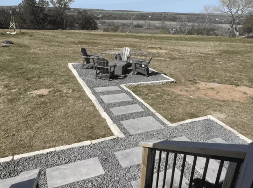 5386 Ranch Road 1376, Unit 79 Fredericksburg, TX 78624 - Photo 20 of 39 View of grassy yard featuring a rural view, a patio area, and an outdoor fire pit