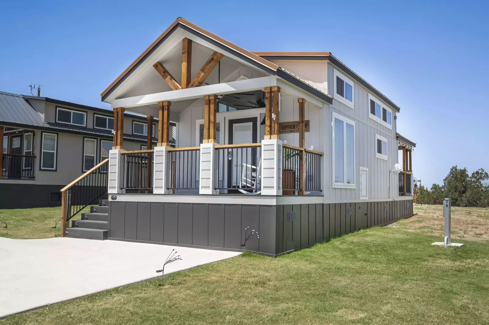 5386 Ranch Road 1376, Unit 79 Fredericksburg, TX 78624 - Photo 2 of 39 View of front of house featuring a front yard and board and batten siding