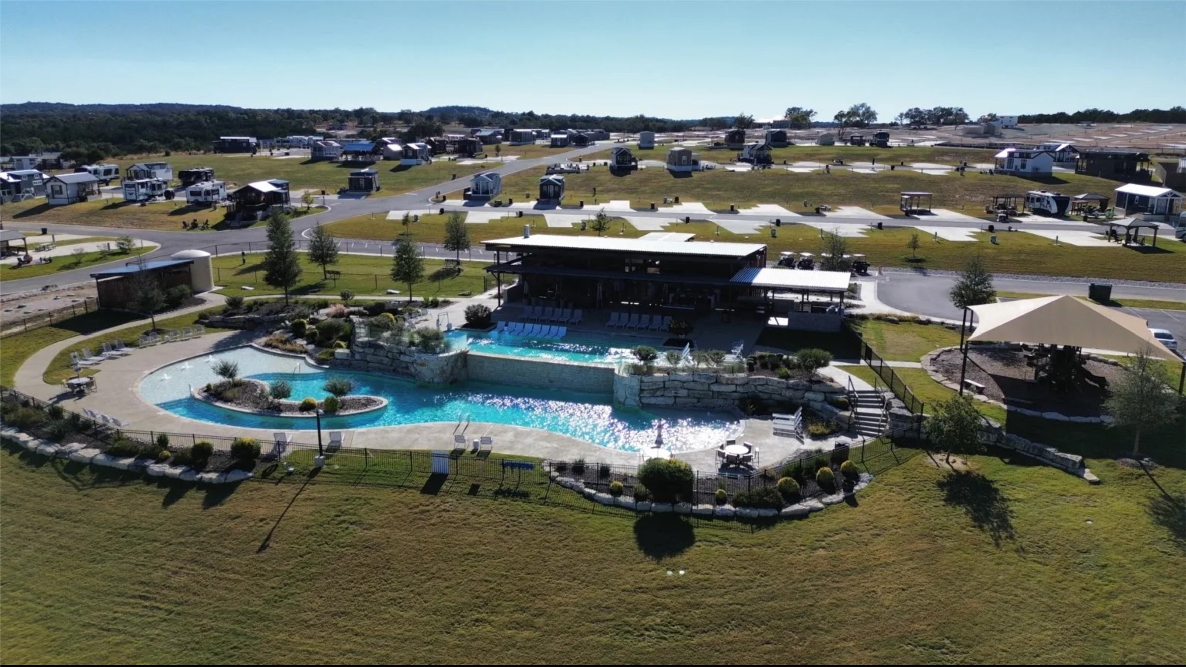 5386 Ranch Road 1376, Unit 79 Fredericksburg, TX 78624 - Photo 29 of 39 Aerial view of property and surrounding area with a pool