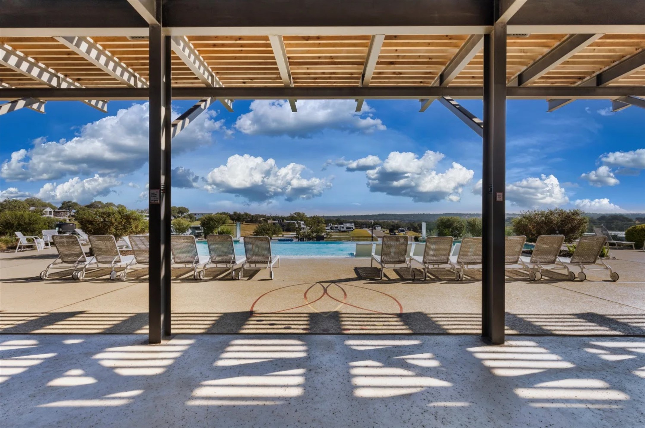 5386 Ranch Road 1376, Unit 79 Fredericksburg, TX 78624 - Photo 31 of 39 View of patio / terrace featuring a pergola and a community pool