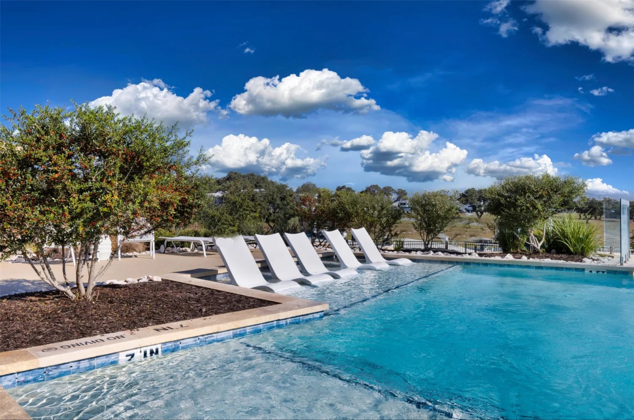 5386 Ranch Road 1376, Unit 79 Fredericksburg, TX 78624 - Photo 33 of 39 Community pool featuring a patio area