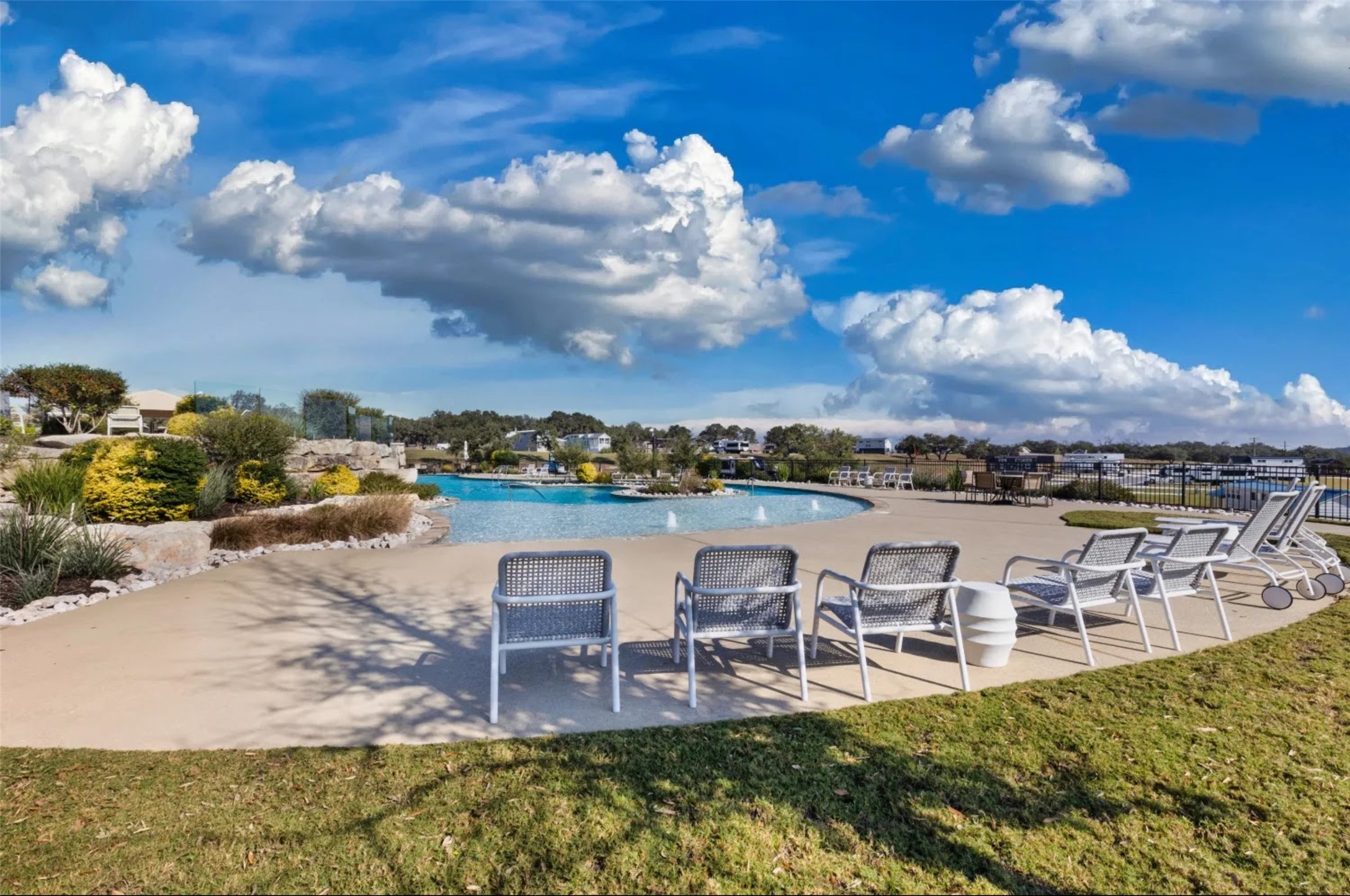 5386 Ranch Road 1376, Unit 79 Fredericksburg, TX 78624 - Photo 34 of 39 Community pool featuring a patio