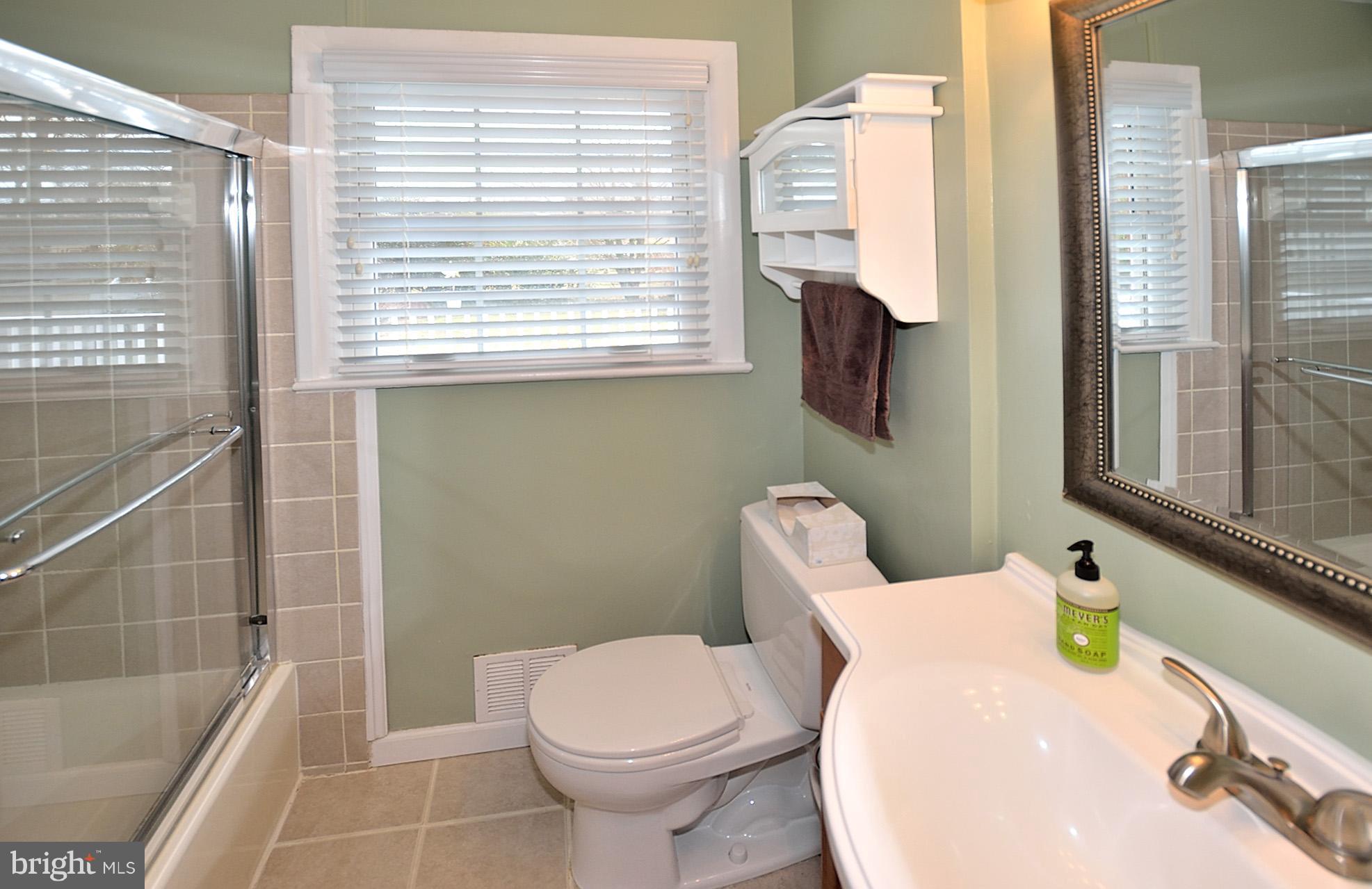 506 Tapawingo Road Southwest Vienna, VA 22180 - Photo 11 of 25 a bathroom with a sink and toilet