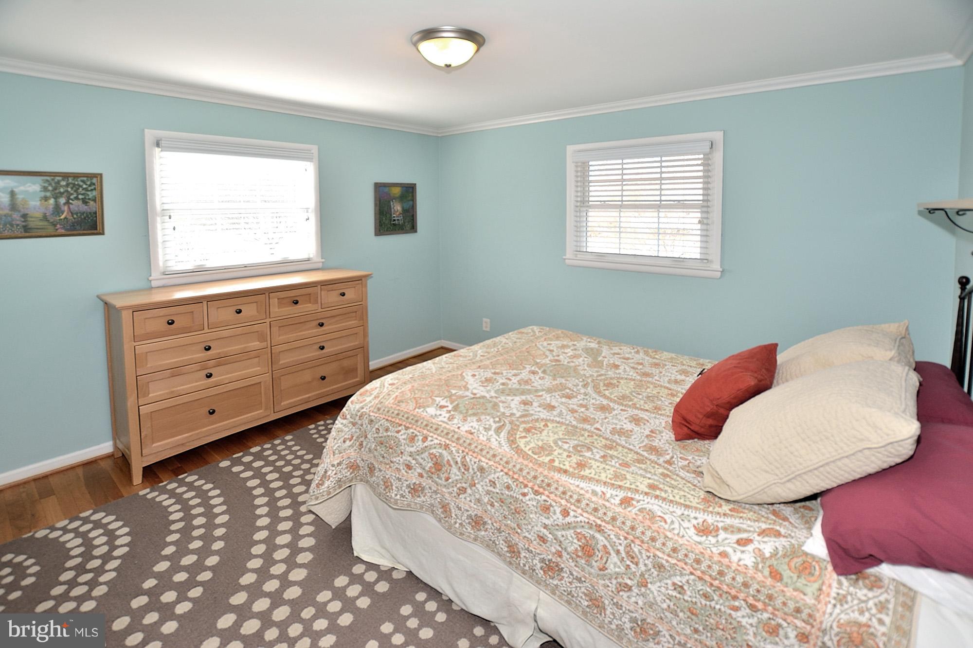 506 Tapawingo Road Southwest Vienna, VA 22180 - Photo 12 of 25 a bedroom with a large bed and a window