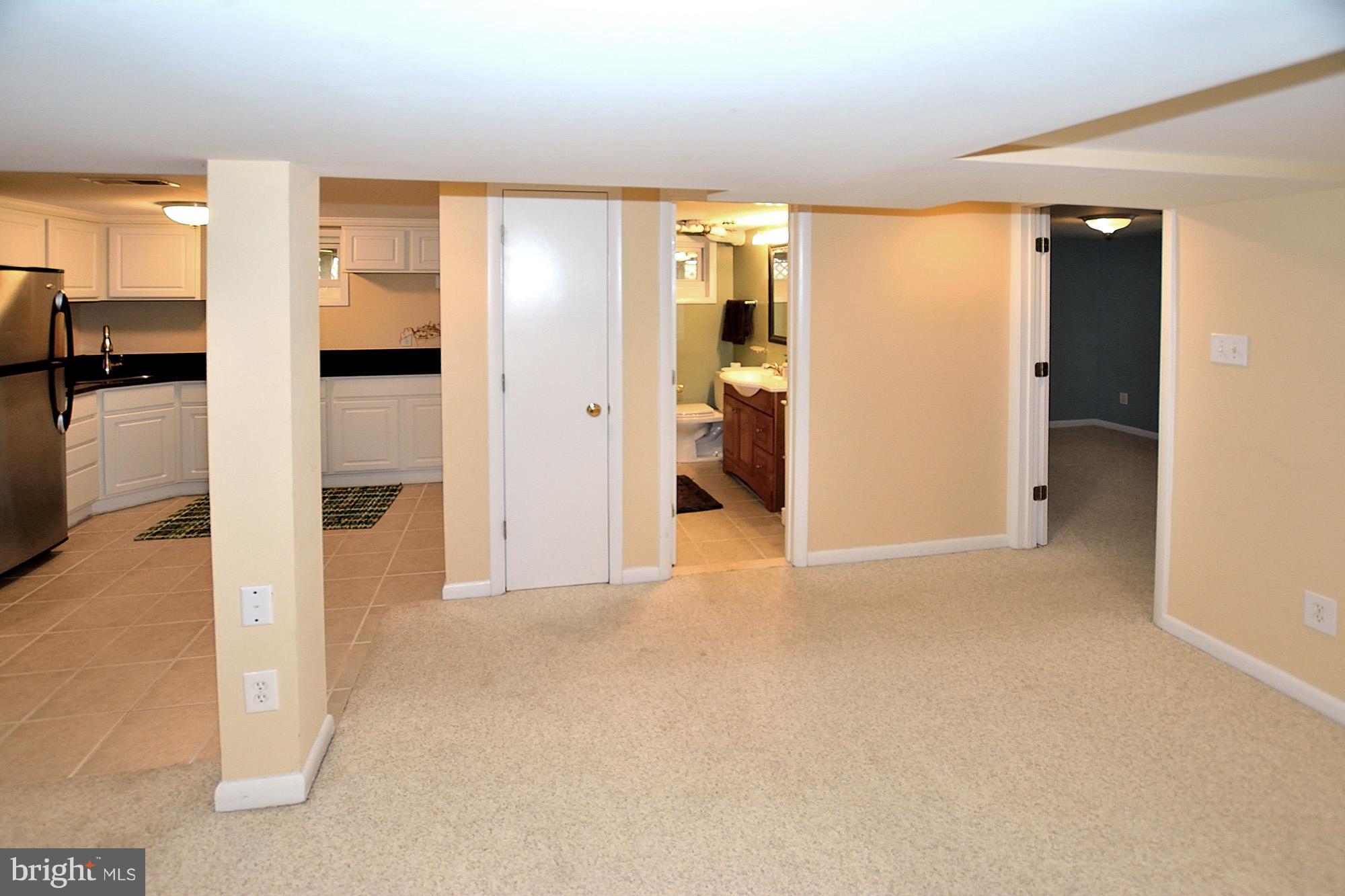 506 Tapawingo Road Southwest Vienna, VA 22180 - Photo 18 of 25 a view of empty room with a kitchen