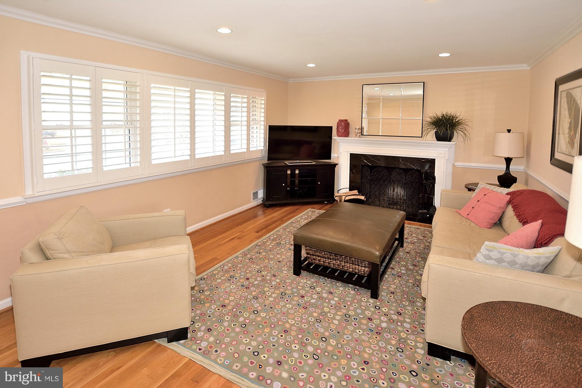 506 Tapawingo Road Southwest Vienna, VA 22180 - Photo 3 of 25 a living room with furniture and a fireplace